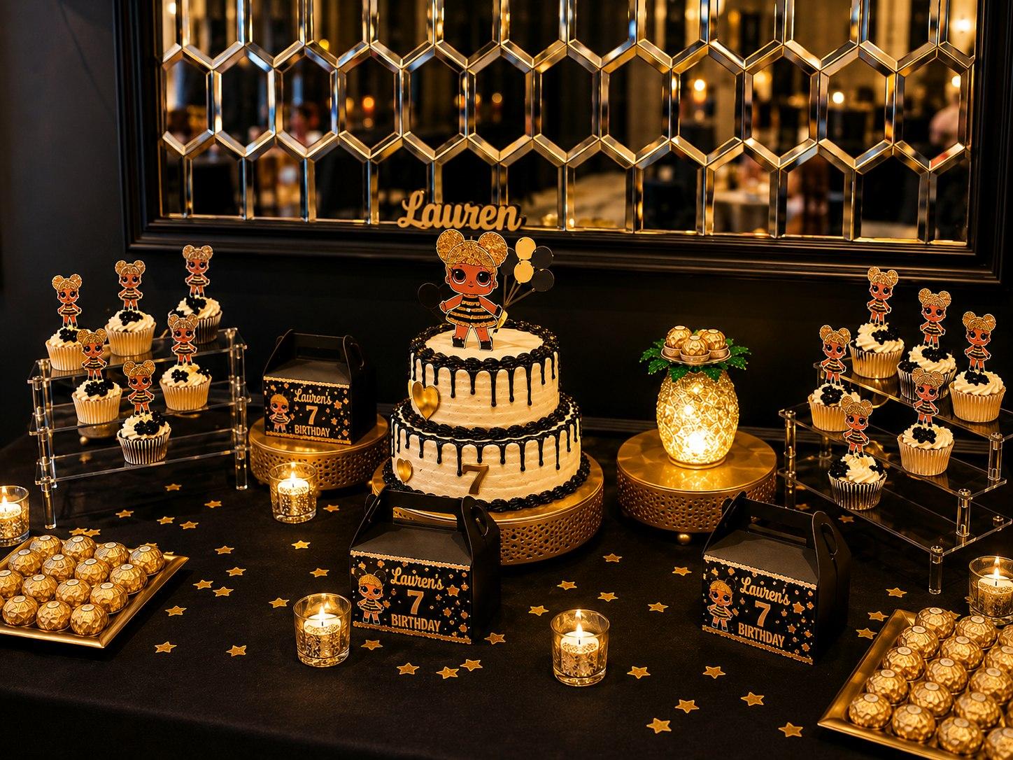 Black and gold dessert table with a two-tier drip cake, themed cupcake toppers, and mirrored backdrop
